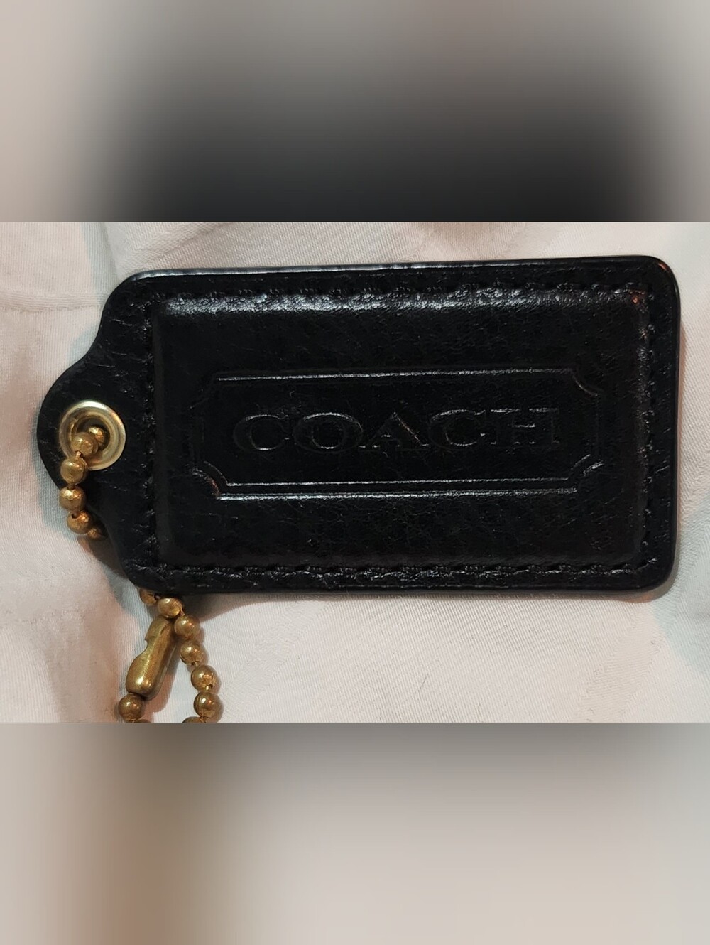 0048. 3 for $75 - Pre-loved authentic black coach hang tag
